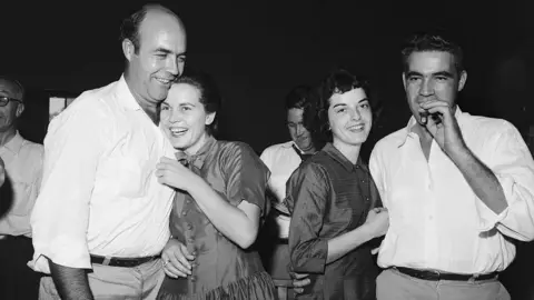 Getty Images Roy Bryant and JW Milam celebrate their acquittal in Till's murder with their wives