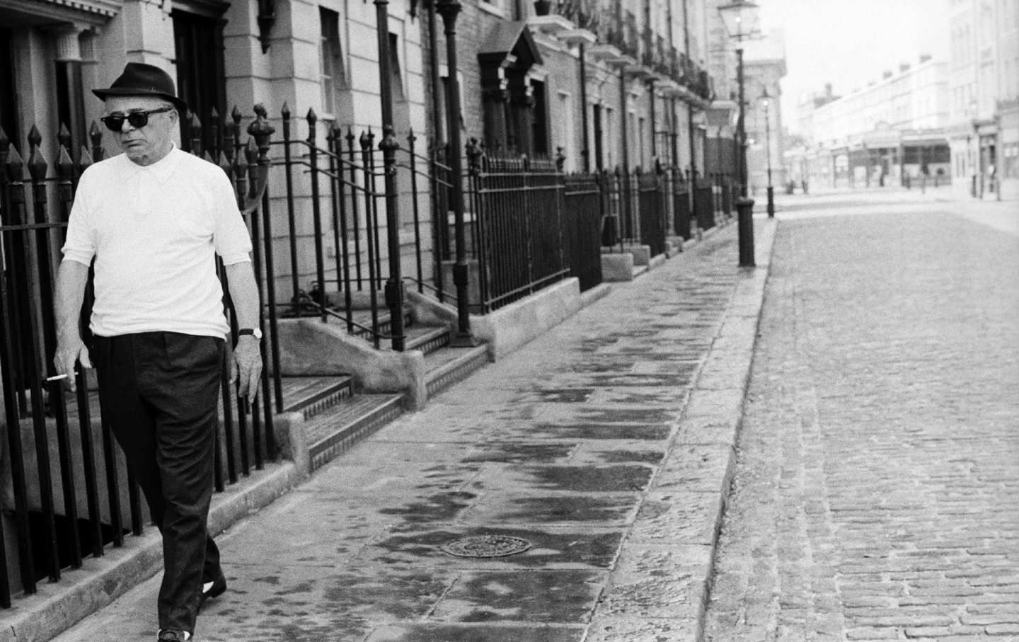 Billy Wilder walks down a London street during the 1969 filming of The Private Life of Sherlock Holmes.