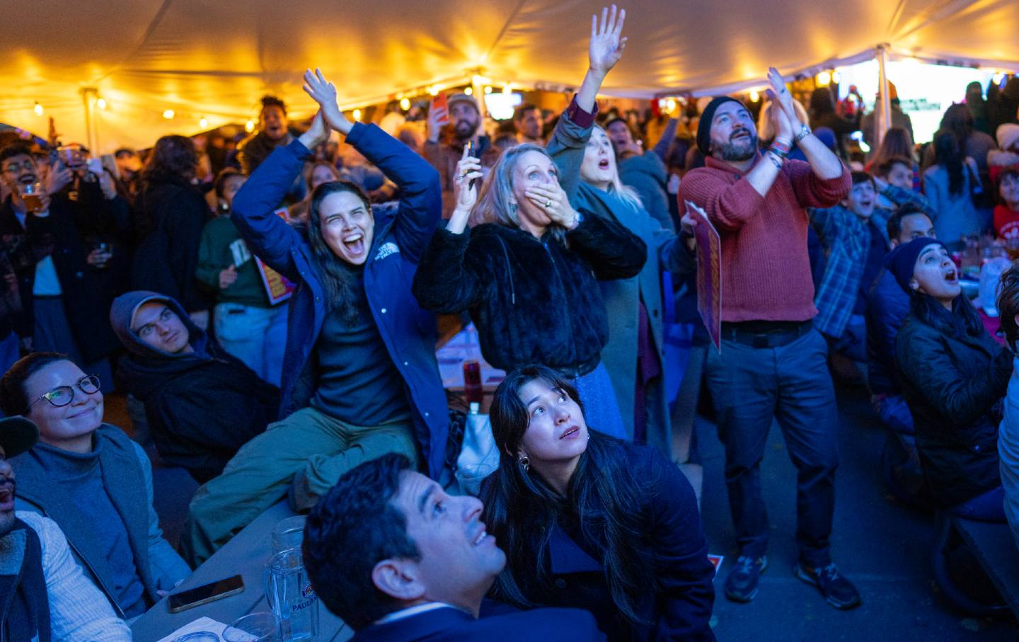 New Yorkers in the neighborhood of Astoria, Queens, celebrate as NY1 projects Zohran Mamdani to win the New York City mayoral election on November 4, 2025.