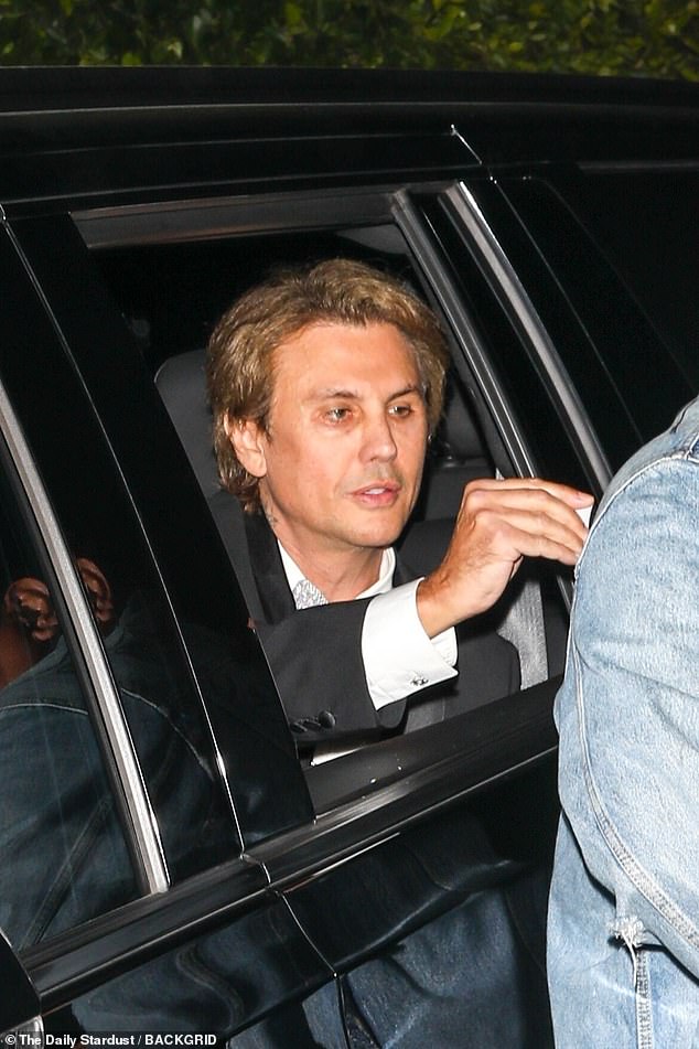 Longstanding family friend Jonathan Cheban, who also goes by 'Food God,' was besuited for the occasion as his own car pulled up to the Bezos estate