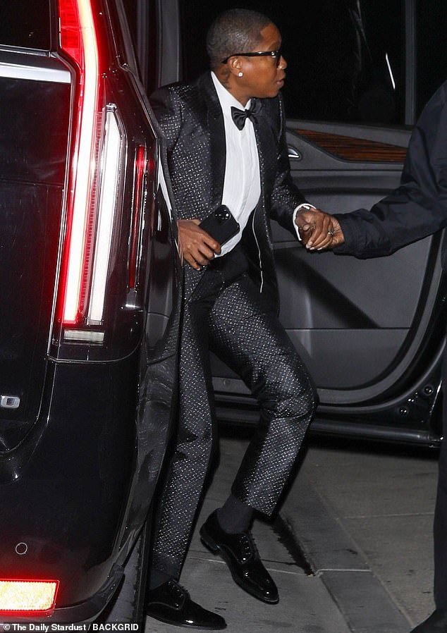 She swung by with her singer wife Jessica Betts, whom she refers to as her 'hersband,' and who arrived in a textured metallic black suit