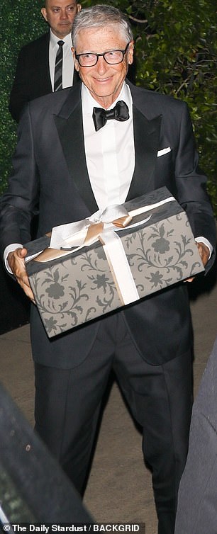 Bill Gates arrived with a wrapped gift in hand
