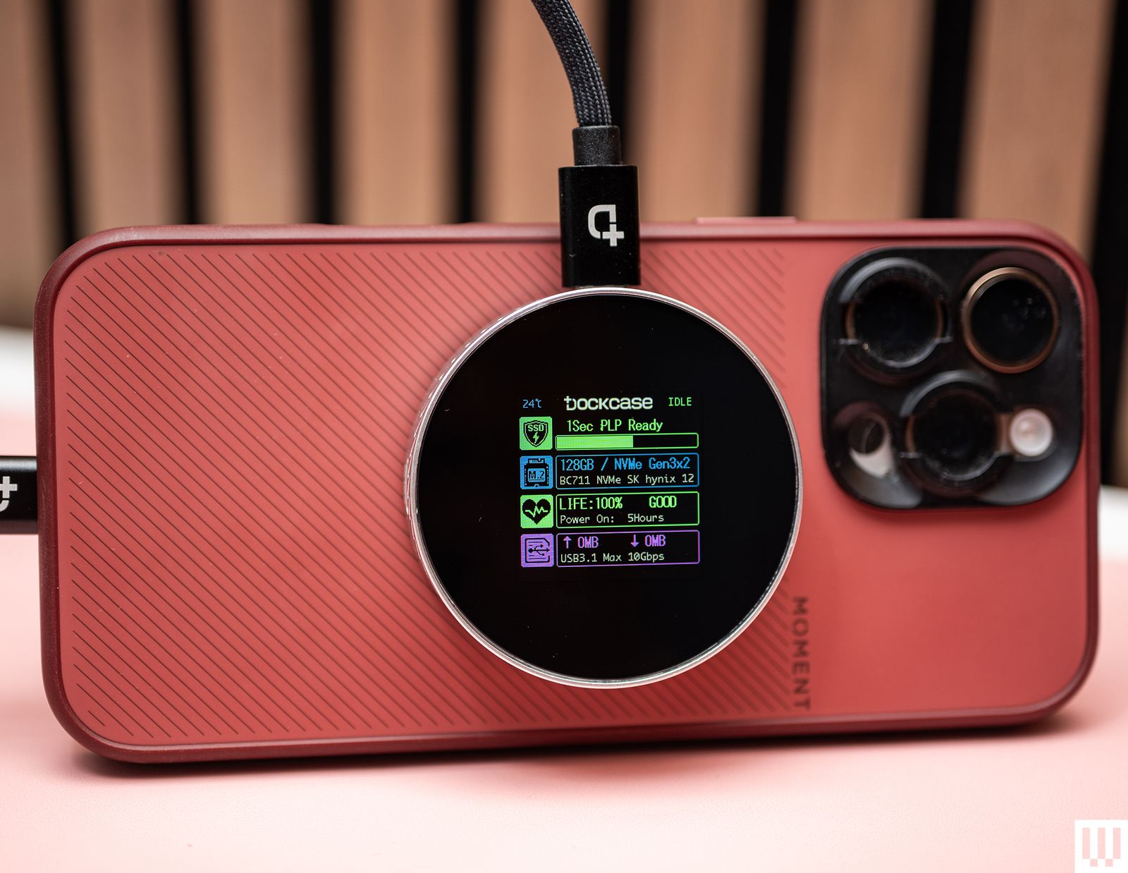 Dockcase Smart MagSafe M.2 NVMe SSD Enclosure on a pink mobile phone