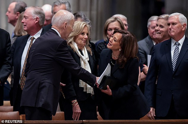 Former U.S. President Joe Biden greets former Vice President Kamala Harris, on the day of a funeral service for former U.S. Vice President Dick Cheney, at Washington National Cathedral, in Washington, D.C., U.S., November 20, 2025. REUTERS/Jonathan Ernst
