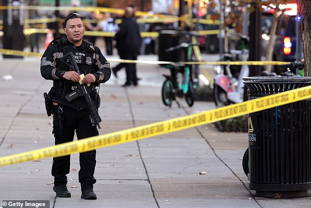 A Secret Service member stands guard at the crime scene