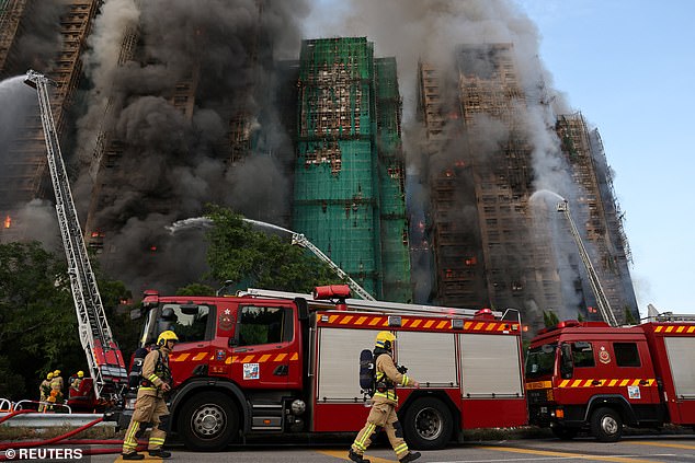 Firefighters work as efforts are underway to extinguish flames engulfing bamboo scaffolding across multiple buildings at the Wang Fuk Court housing estate in Tai Po, Hong Kong, China, November 26, 2025