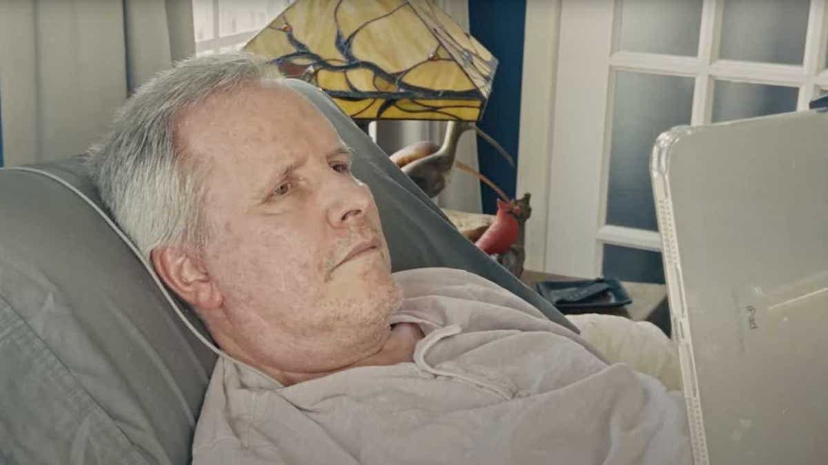 A man with ALS uses a brain-computer interface to operate an iPad.