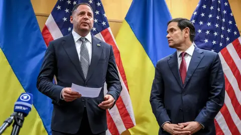 AFP via Getty Images US Secretary of State Marco Rubio (R) and Ukraine's Presidential Office Chief of staff Andriy Yermak hold a press conference following their closed-door talks on a US plan to end the war in Ukraine at the US Mission in Geneva, on November 23, 2025