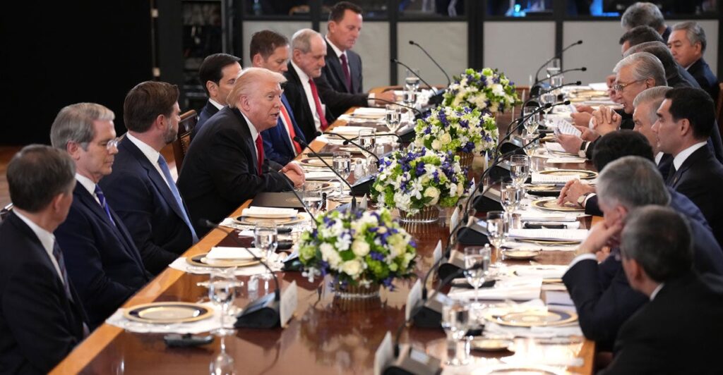 President Trump sits at the center of a long dinner table with Central Asian leaders.