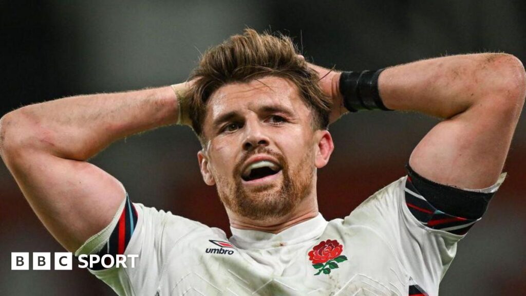 Henry Slade with his hands on his head