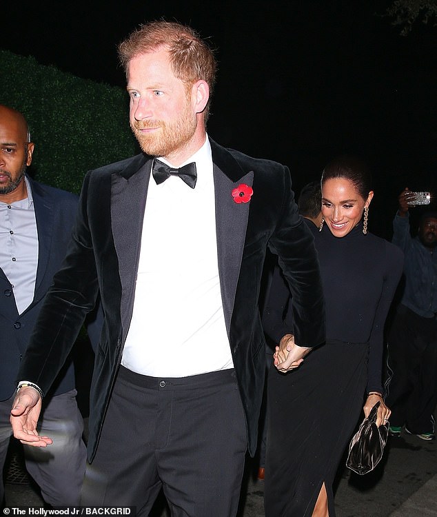 While Harry wore a stern expression as he headed into the beano, Meghan, holding his hand and trailing just behind him , was aglow with an ear-to-ear smile