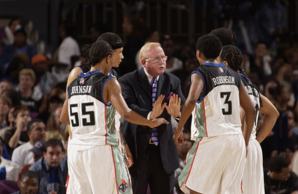  Head Coach Richie Adubato of the New York Liberty talks with his staters about the game plan for containing the Washington Mystics during game 3 of the Eastern Conference FInals of the 2002 WNBA Playoffs at Madison Square Garden on August 25, 2002