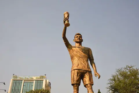 Anadolu via Getty Images A general view of the Lionel Messi's 70-foot-tall statue in Kolkata, West Bengal, India on December 14, 2025. The statue's unveiling took place virtually during Messi's visit to Kolkata. (Photo by Sumit Sanyal/Anadolu via Getty Images)