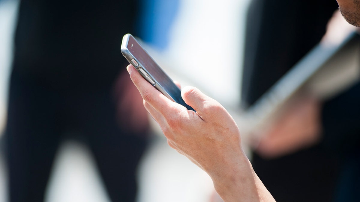 Person using their phone.