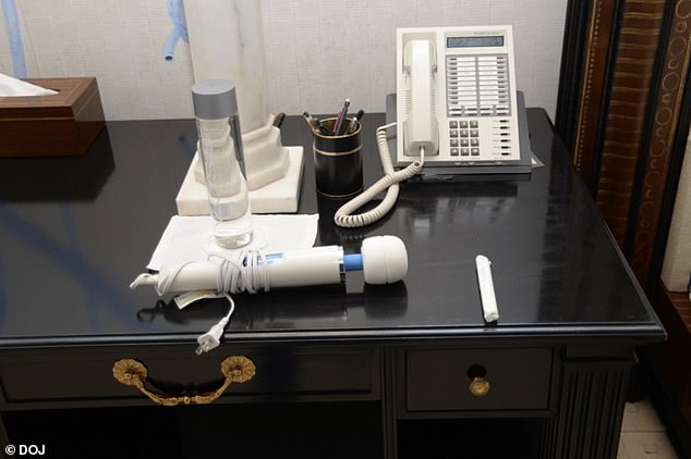Sex toys and what appears to be a tampon are pictured on a desk