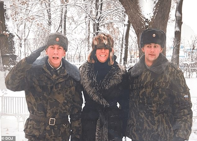 Ghislaine Maxwell appears to be pictured with two Russian soldiers