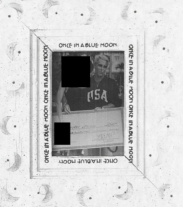 Epstein in a framed photo posing with check signed by Trump
