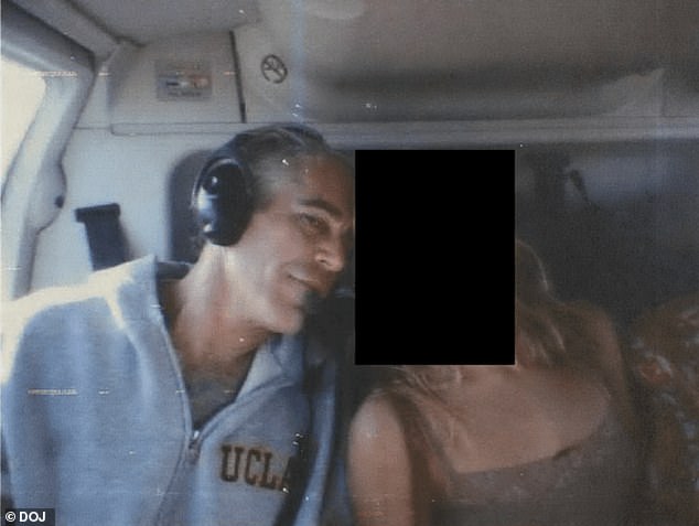 Epstein is pictured in a helicopter with a redacted woman