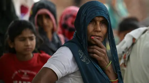 AFP via Getty Images In this photograph taken on May 6, 2024, women from India's marginalised Dalit caste are pictured in Ayela village on the outskirts of Agra city. 