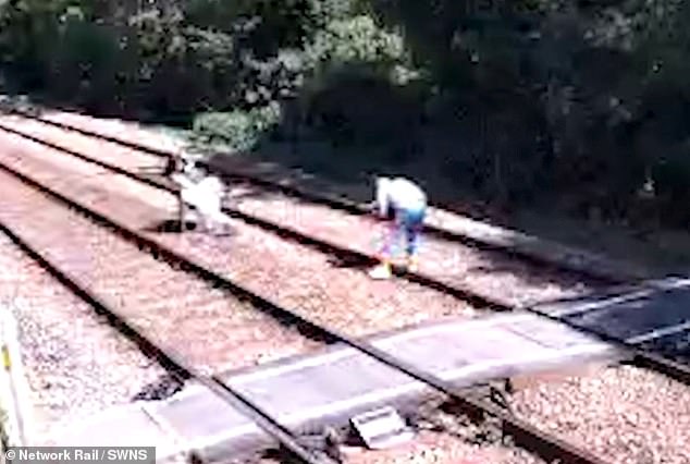 A couple were caught on CCTV taking part in a photoshoot at the notorious crossing. The footage was released by Network Rail in a bid to urge people to stay off the track