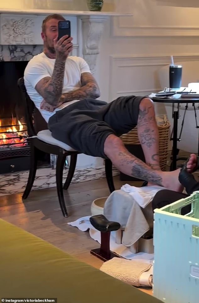 The family appeared to be getting into the spirit of things as Sir David (pictured), 50, enjoyed a festive home pedicure