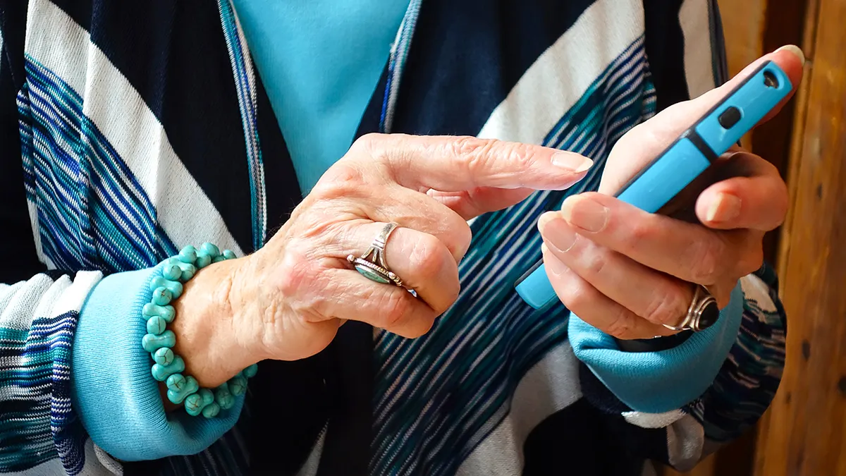 Woman typing on her smartphone.