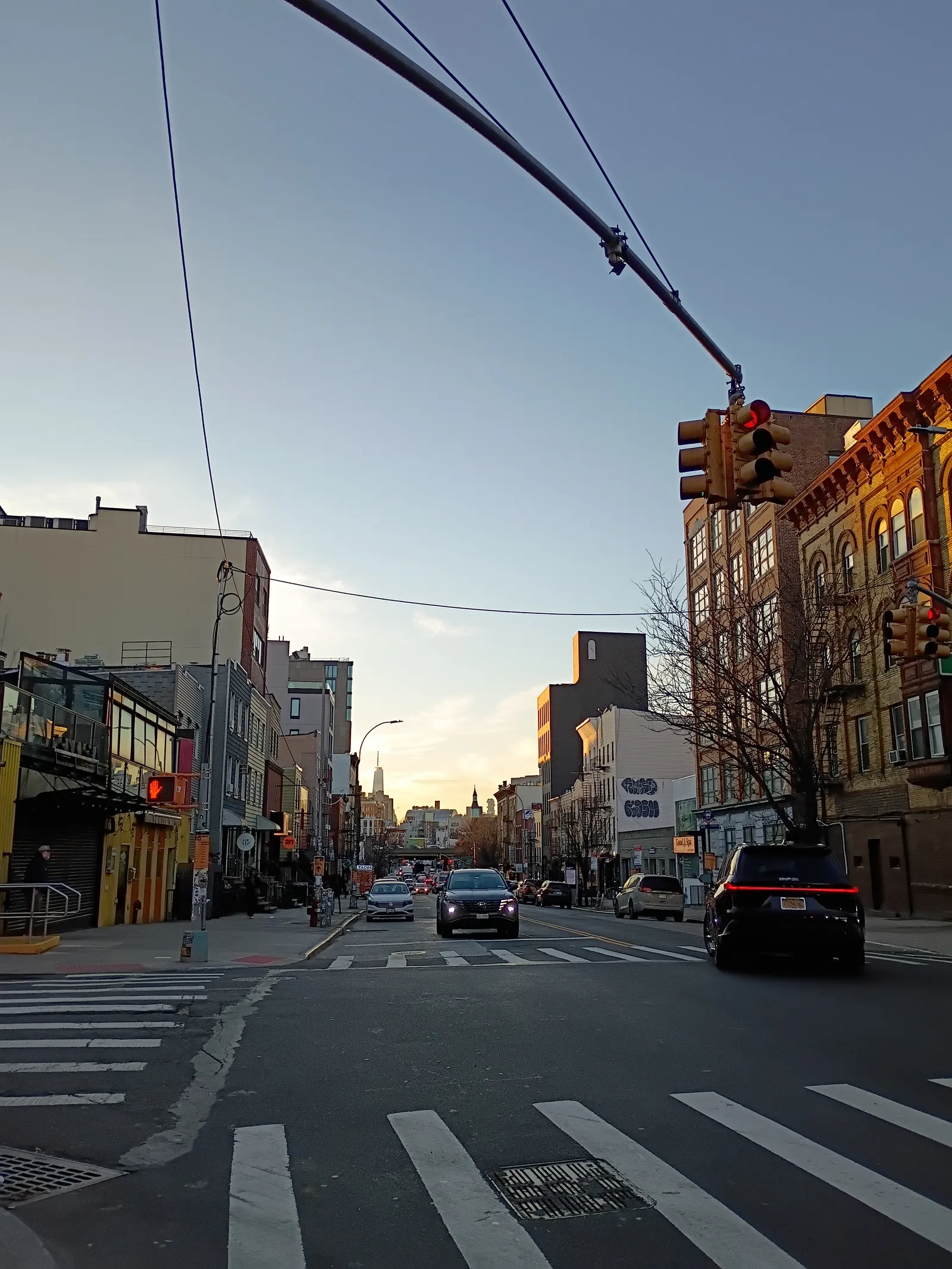 Image may contain Urban City Road Street Architecture Building Cityscape Car Transportation Vehicle and Person