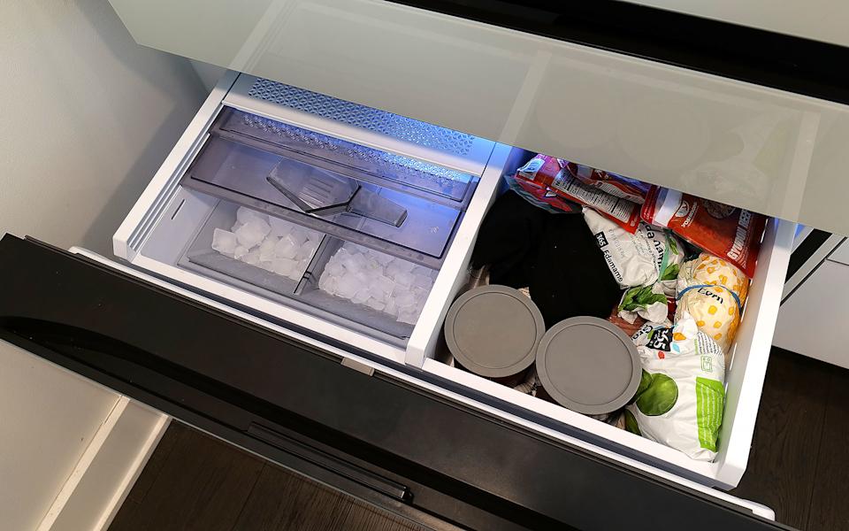 The top shelf in the freezer also contains the ice maker, which comes with an included scoop and the ability to make two difference kinds of cubes. 