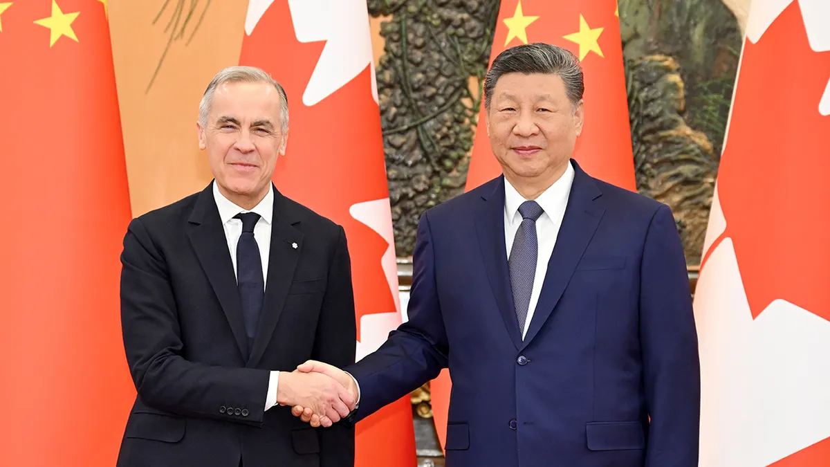 Xi Jinping and Mark Carney shaking hands at the Great Hall of the People in Beijing.