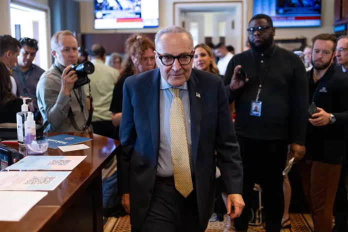 Senate Minority Leader Chuck Schumer (D-NY) leaves a meeting with reporters.
