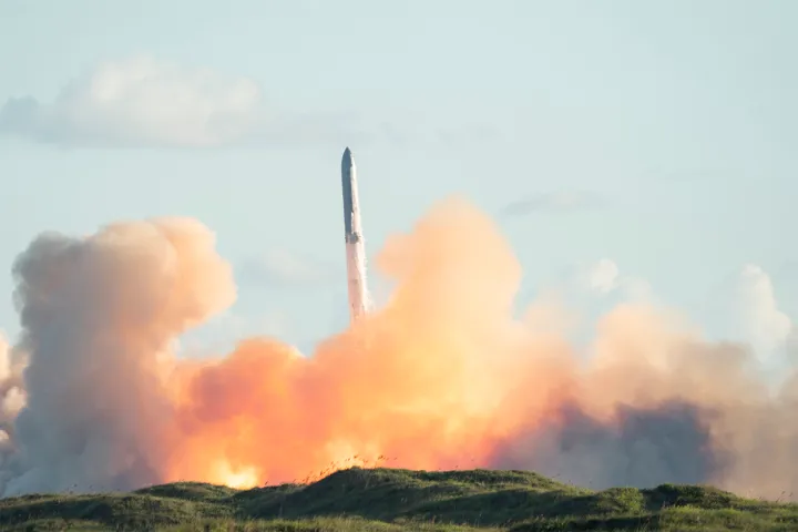 SpaceX's Starship rocket 38 launches during the 11th test flight on October 13, 2025 as seen from South Padre Island in Texas. (Photo by GABRIEL V. CARDENAS/AFP via Getty Images)