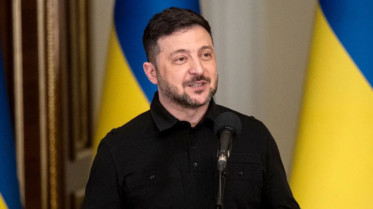 Ukrainian leader addresses reporters from a podium while delivering remarks to the media.