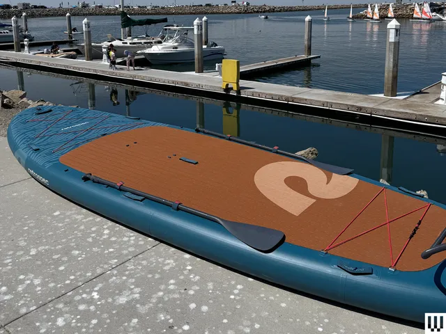 Image may contain: Water, Waterfront, Port, Transportation, Vehicle, Watercraft, Pier, Boat, Sailboat, Person, and Harbor