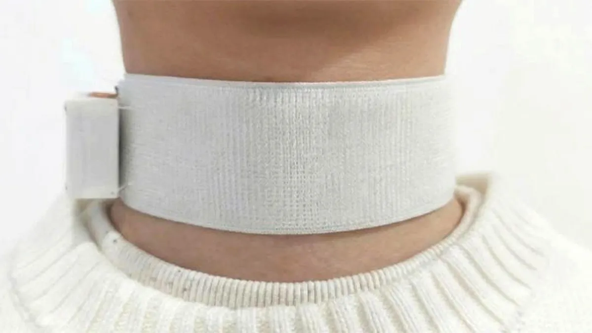 A Revoice device on a patient's neck
